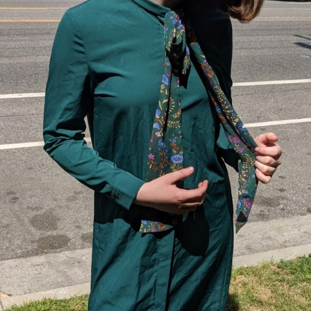 dark green button down dress with multicolored bow
